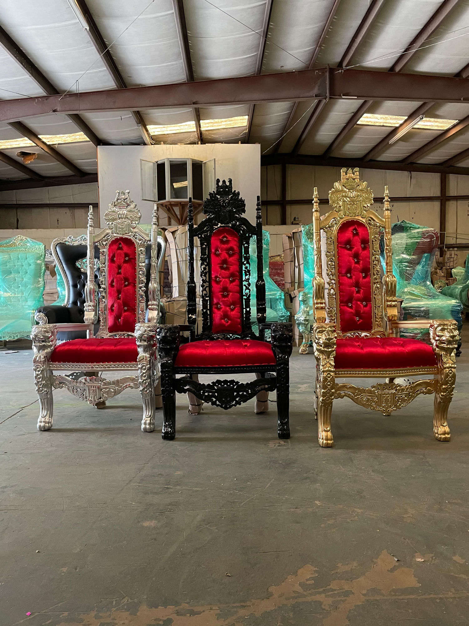 Red and gold throne chairs in the Monroe warehouse